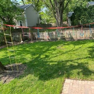 50 ft ninja warrior course with ten accessories.